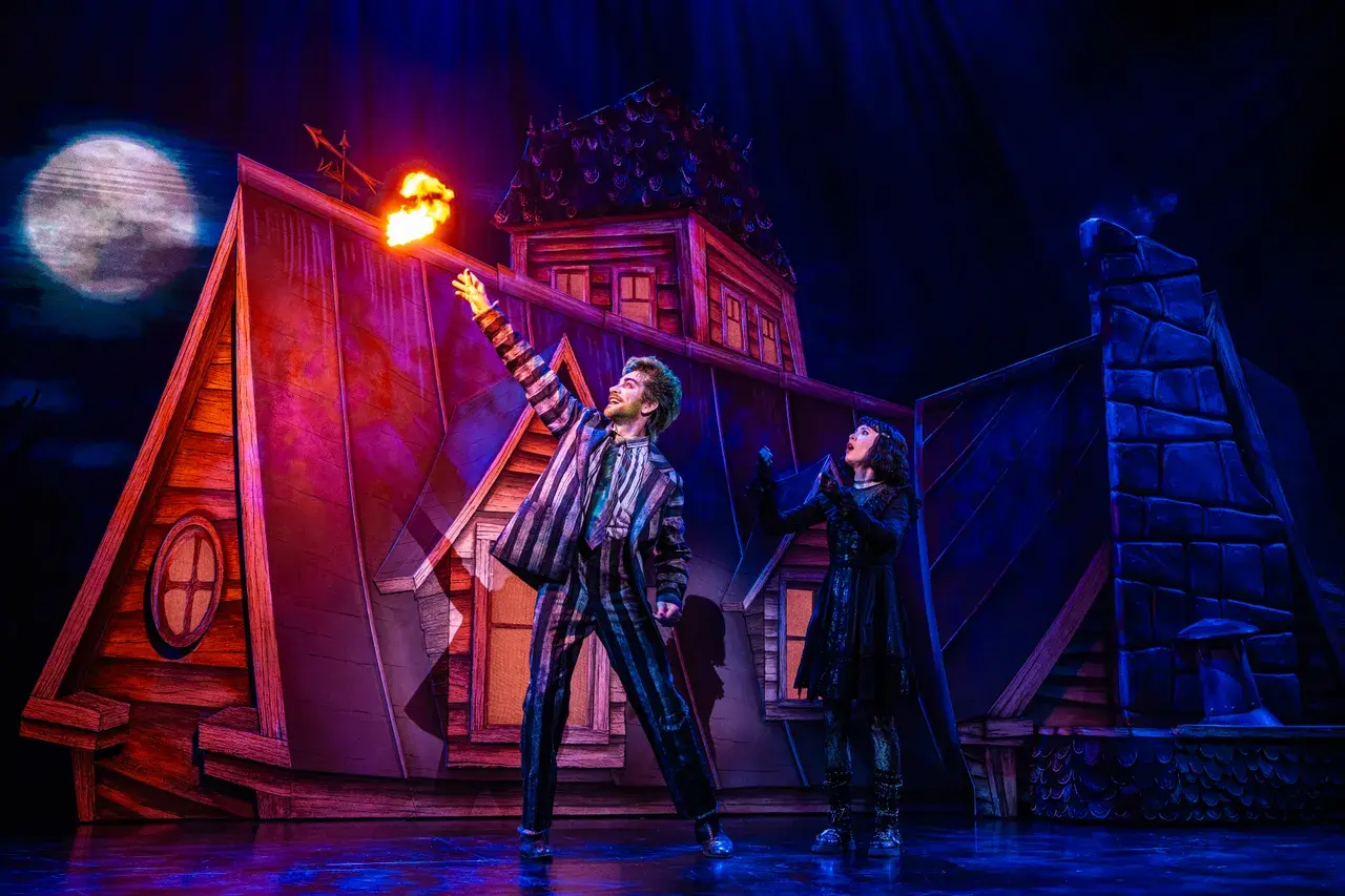 A lit Beetlejuice The Musical set piece on stage