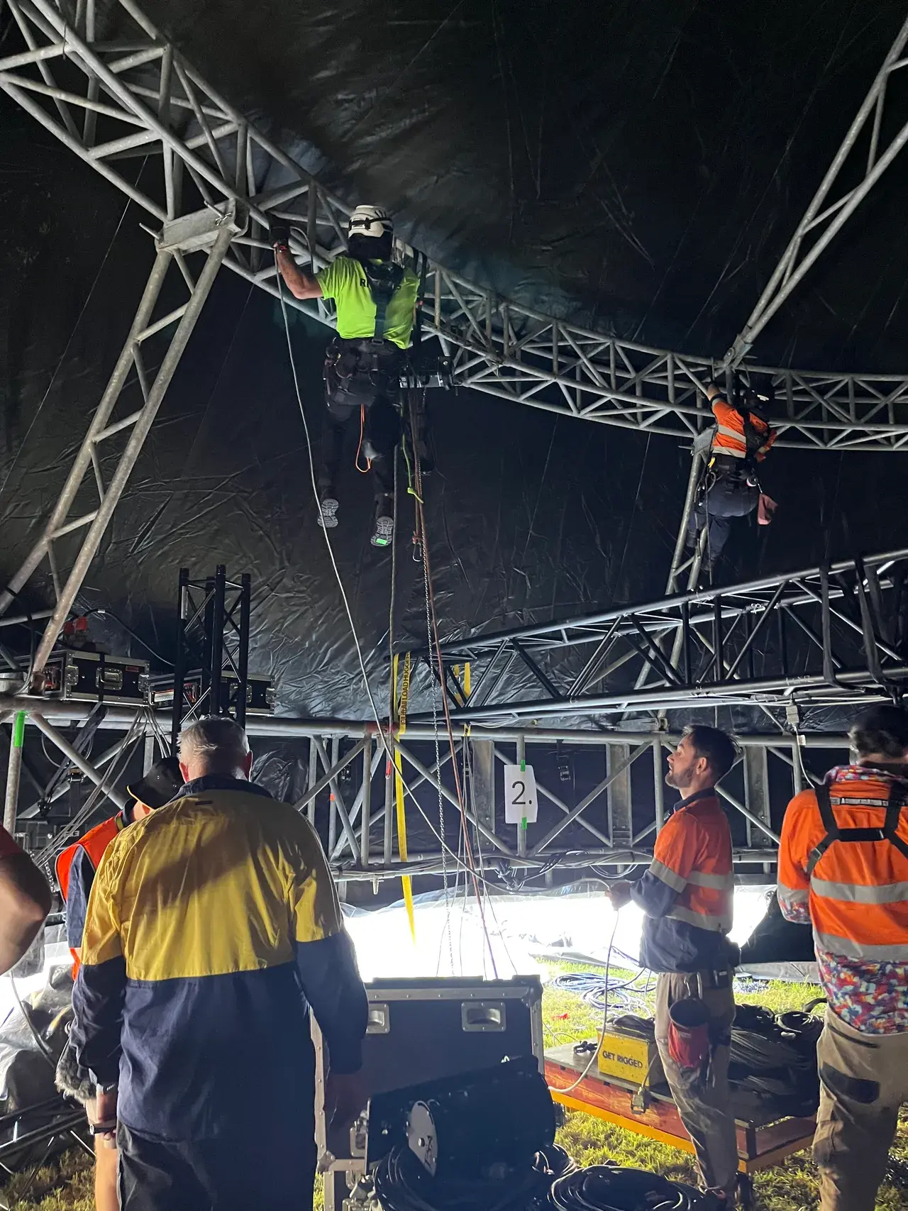 Crew rigging the base ring of the Come Alive arena on site