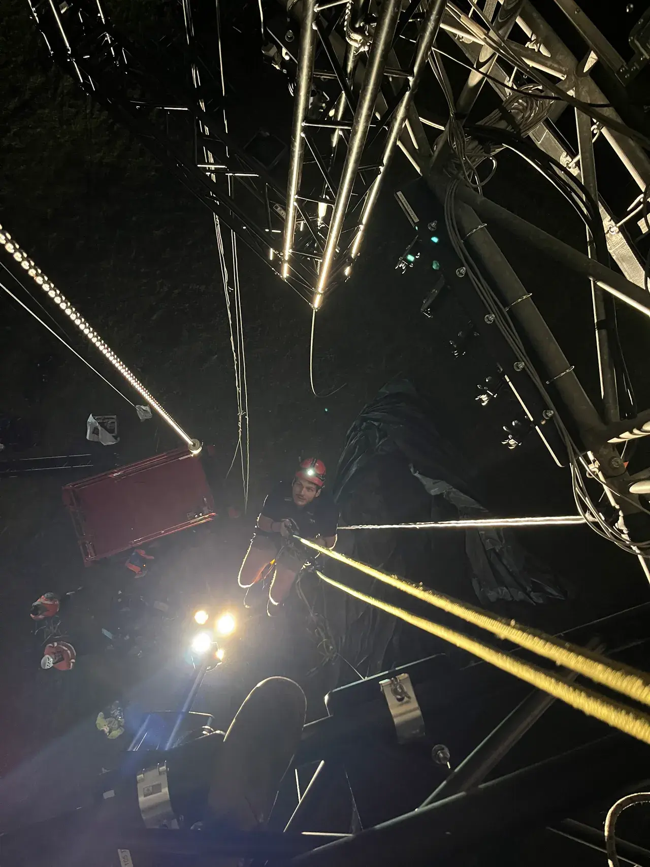 A TSA rigger working up in the arena truss dome