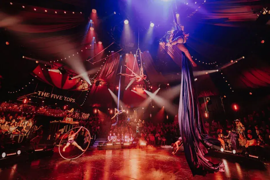 A teeterboard acrobat mid-flight in the Come Alive arena
