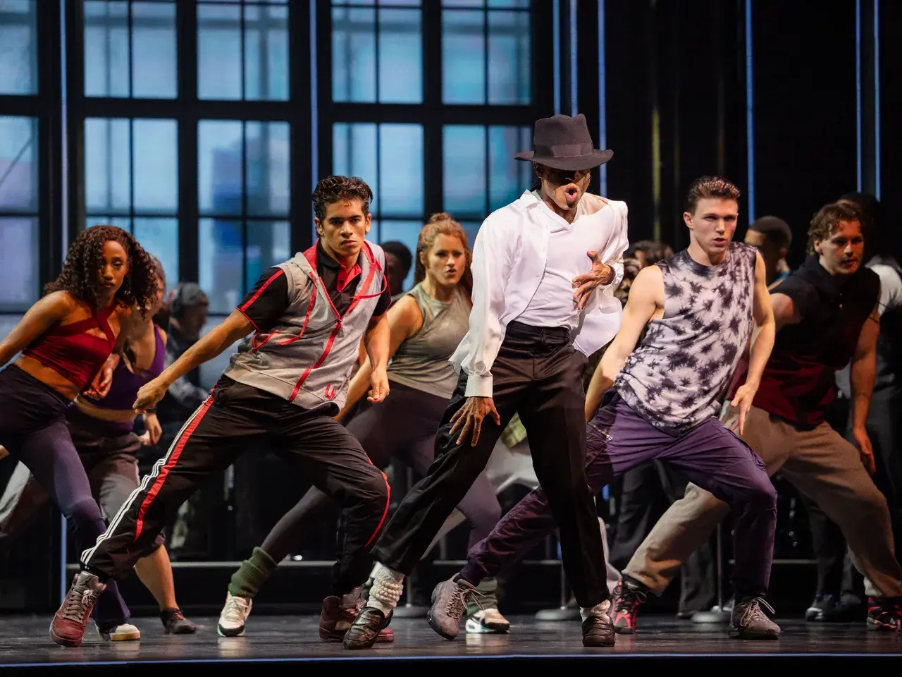 MJ The Musical Australian cast mid-choreography under stage lighting. Photo by Daniel Boud.