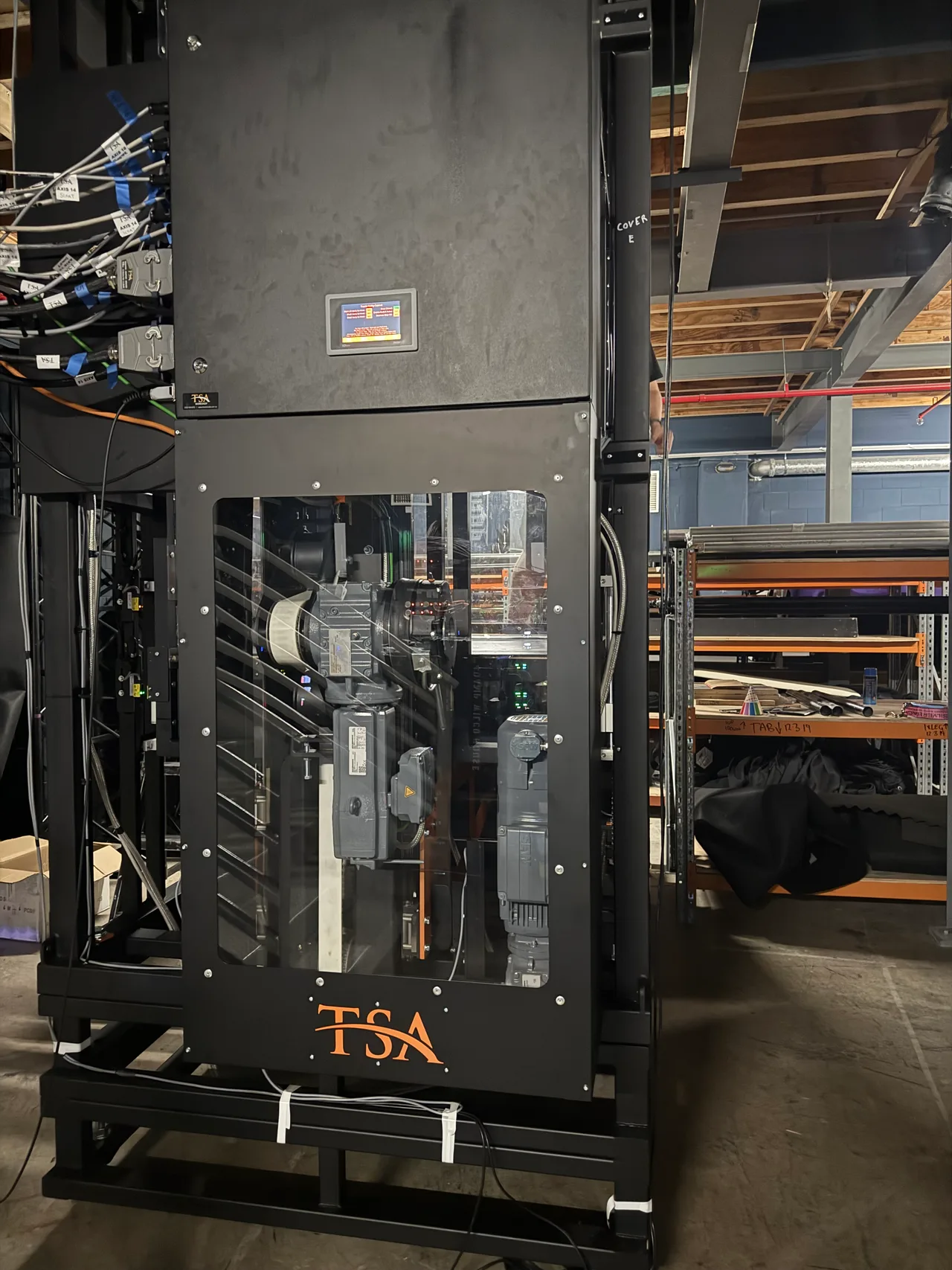 TSA automation winch rack with touchscreen standing backstage