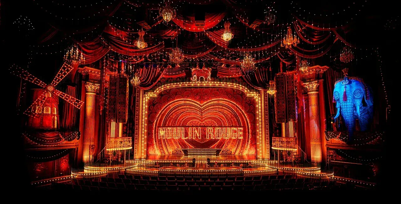 Wide view of the Moulin Rouge theatre, framed in red Reveal-built drapery. Photo: Michelle Grace Hunder.