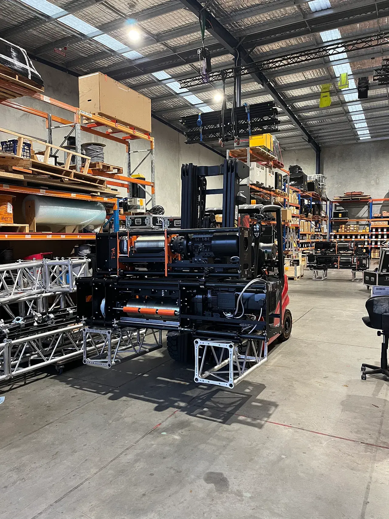 TSA drum winches and truss staged in the warehouse for load-out